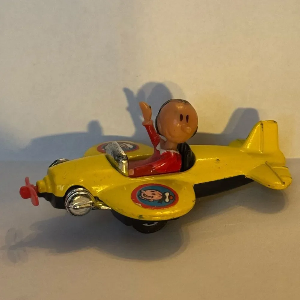 vintage 1980 Corgi Juniors Olive Oyl yellow airplane from the Popeye cartoon